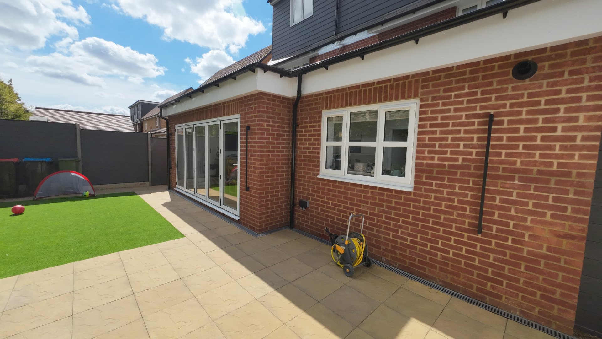 Single storey kitchen extension with bi-folding doors and roof lanterns in Brooklands, Milton Keynes